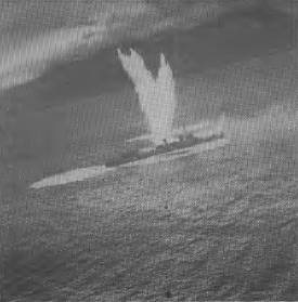 A Japanese destroyer stopped and sinking after three near misses by an Australian bomber during the Battle of the Bismarck Sea. This graphic shot is believed to have been taken by the famed Damien Parer.