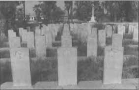 Graves in the Baghdad North Gate Cemetery. The grave in the centre is that of Petty Officer Gilbert flanked by two sailors from HM Submarine E7.