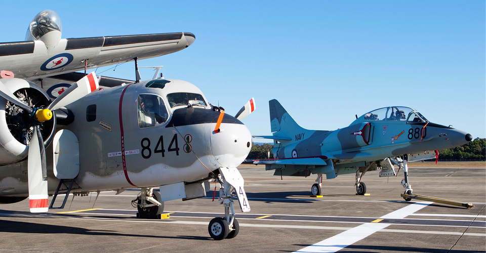The TA-4 Skyhawk alongside a historic Grumman Tracker